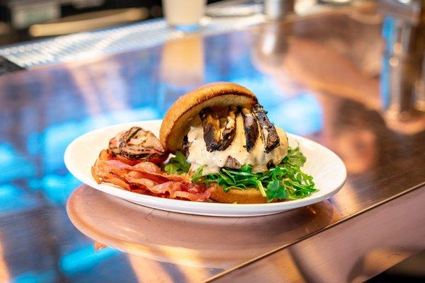 Cheese stuffed burger with portobello and prosciutto