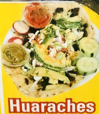 Meat ,cheese, lettuce,avocado,tomatoes,sour cream  Hand made Huarache  Carne,queso,lechuga aguacate,tomate,crema Hecho a mano el Huarache