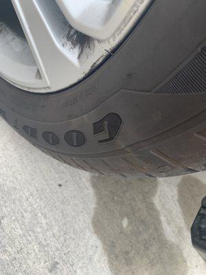 Bump on tire on letter G.