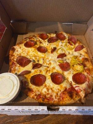 Mushroom with pepperoni and banana peppers on half