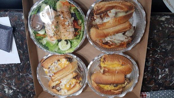 Salmon salad, buffalo hero, bacon ranch hero, and Philly cheesesteak hero