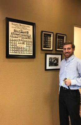 Dr, Zach proudly displaying his grandfather's dental legacy in his office! Fun fact: Dr. Carnow is a third generation dentist!