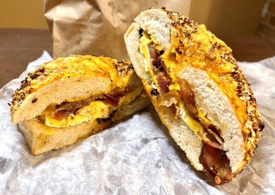 Bacon egg and cheese on jalapeño cheddar everything bagel