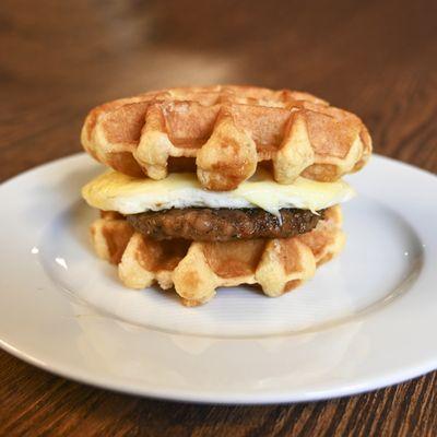 Waffle sandwich with egg, cheese and sausage