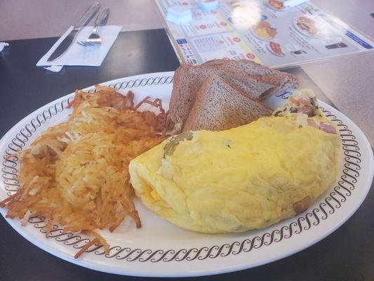 Fiesta Omelet with hashbrowns and wheat toast.