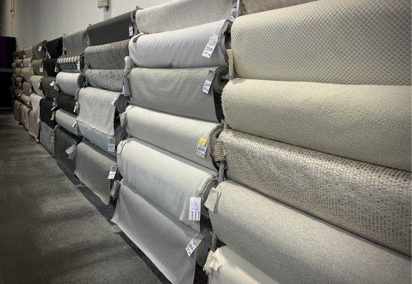 Lots of whites, beiges, sands and other neutrals in stock for upholstery.  Many textures with overlapping colors to choose from