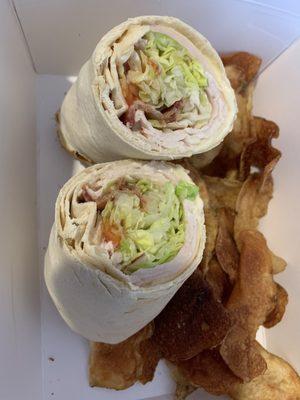 Bobby V's: ham, American cheese, Mayo, lettuce, tomatoes, bacon on toasted white wrap with chips.