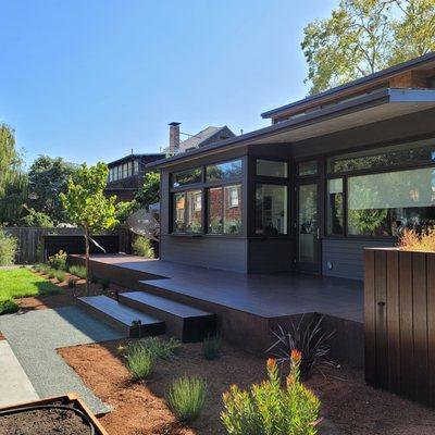 Landscape full back yard remodel, Concrete, irrigation, mosso bamboo decking, steel frame, outdoor kitchen, driveway, plants, Oakland CA