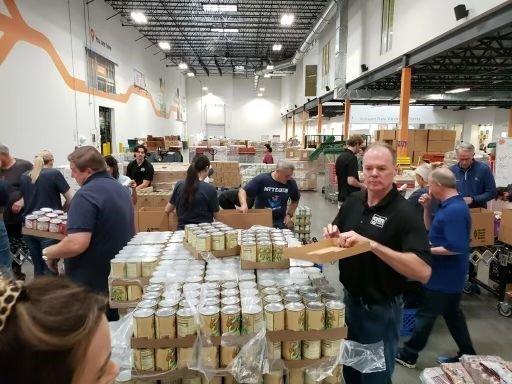 Helping our friends from NTT Data volunteer at the North Texas Food Bank