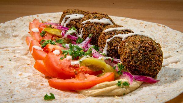 FALAFEL WRAP
 
 Hummus spread, tomato slices, signature turnips, mid-east pickles, parsley, tahini sauce, and four fresh falafels