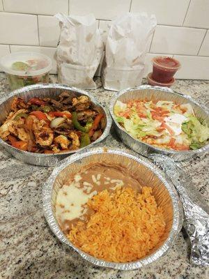 Texas Fajitas with steak, chicken, shrimp Burritos Deluxe with shredded chicken and beef tips