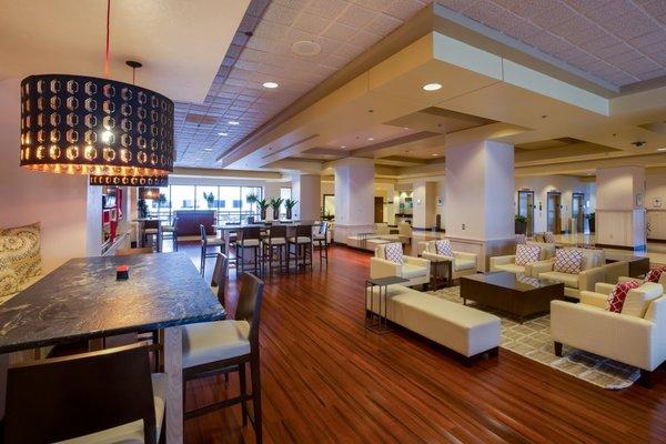 Renovated and expanded hotel lobby offers communal seating and complimentary WIFI.