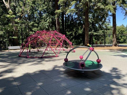 Climbing structure and merry go round