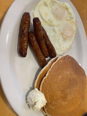 Two egg breakfast with pancakes and sausage