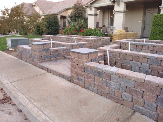 Stonewall II, column kit, pavers, and bullnose in Positano.  Black column caps are black limestone from the A&A yard.