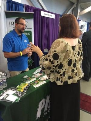 Discussing air quality at Pride's booth at Prince William Chamber's Connections.