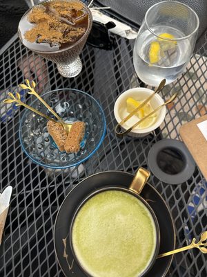 Iced americano with cinnamon and hot matcha latte