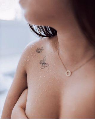 Tiny butterflies tattoo.