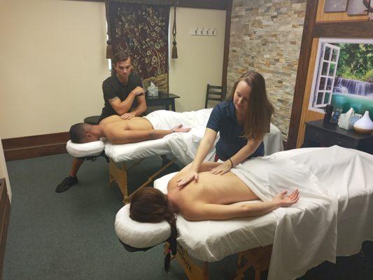 Therapist Jerrica and Adam performing a couples massage