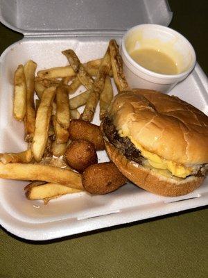 Charcoal burger cook out style no onions, add cheese, fries, and hush puppies delicious with the honey mustard from the back.