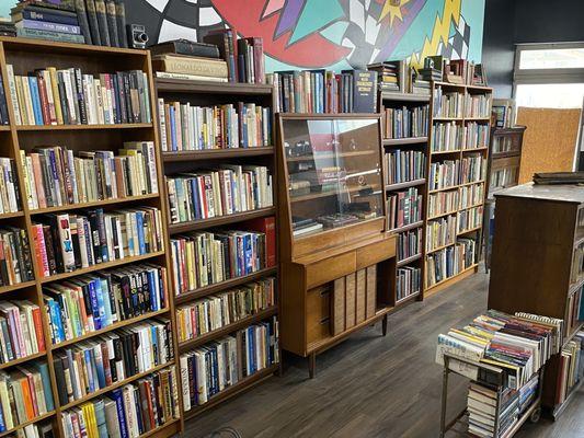 The books displayed on the back wall.