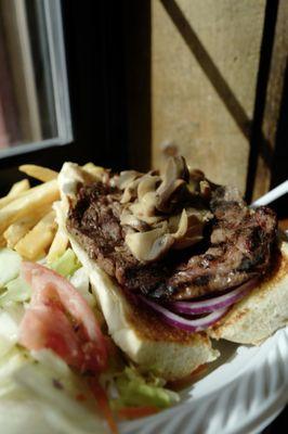 Steak Sandwich with sweet brown onion, and butter mushrooms