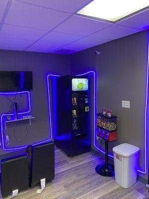 PlayStation 5, gaming chairs, gumball machine and a soda vending machine