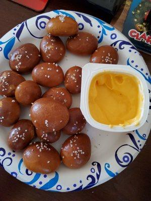 Pretzel bites with nacho cheese dipping sauce.