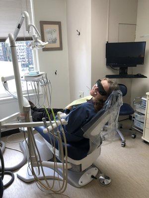 Our hygienist Radmila being silly while having a cavity filled.