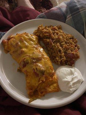 Beef enchiladas with salsa and cheese added to the top