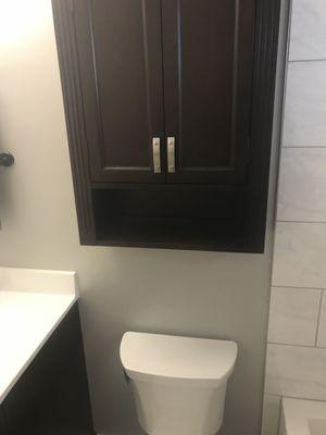 This is also part of the 2nd floor bathroom with a cabinet above the stool for more storage