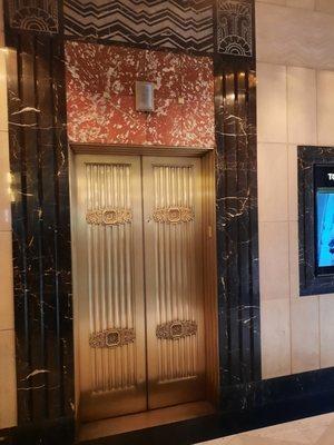 Art Deco elevator doors with Marble surround and floor