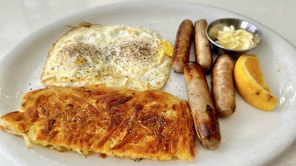 2 eggs w/sausage bfast $18 + tax & tip: ~$24 (breakfast comes w/crispy shredded hash browns)