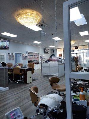 The variety of polishes, a couple of the nail tech stations and a slight glimpse of the pedicure area