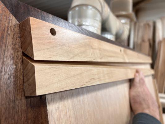 This European style hanging bracket will make it simple to install this heavy walnut framed mirror