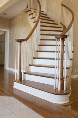 Spiral staircase and hardwood flooring by Metro Atl. Floors