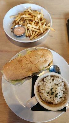 Alligator poboy with gumbo and a side of fries