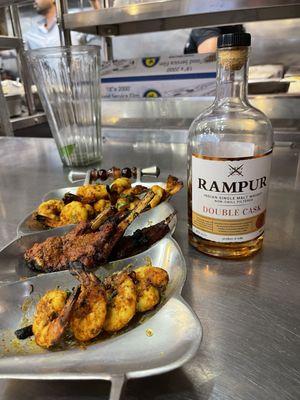 Enjoy Tandoori shrimp and lamb chops with double cask Rampur whiskey from India