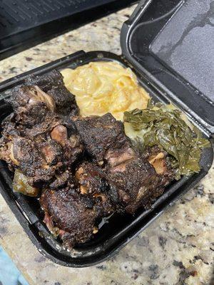 Smoked Oxtails, macaroni and cheese, collard greens