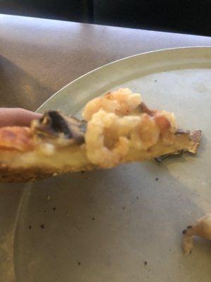 The crust of shrimp pizza.