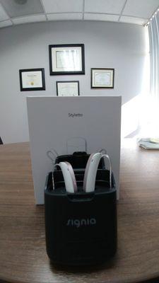 The new Signia Styletto hearing aids are so sleek, great sounding, and comes with a portable charger.