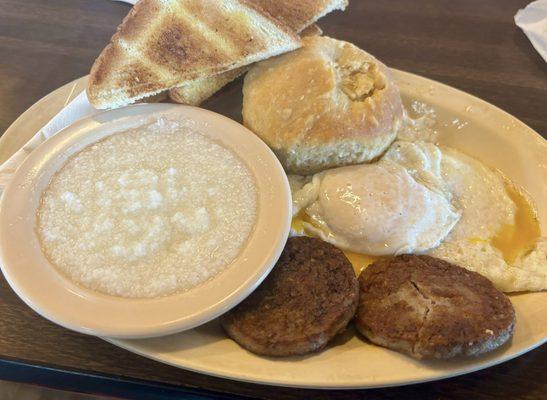 Over easy eggs with grits. I had Sausage and biscuits on the side a lot of food. They all came with.