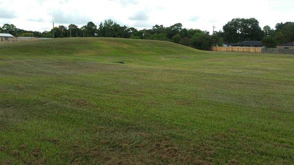 A giant mount in front of retention pond