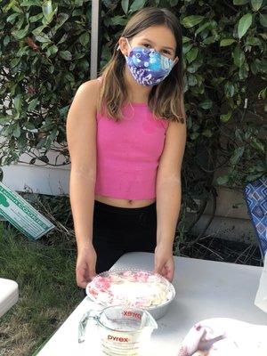 Proud of her cake in summer camp