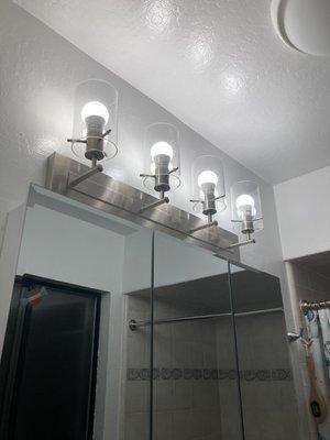 lights and cabinet installation in the bathroom