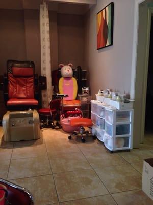 Cute children's pedi chairs with DVD players. :-) Curtains between each chair for privacy if wanted.