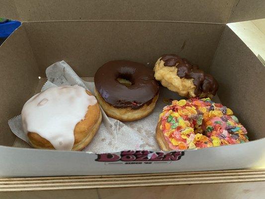 Custard Cruller, Fruity Pebbles, raised chocolate dipped, and raspberry stuffed