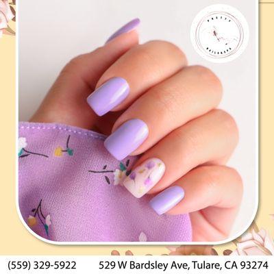 Embrace elegance with our purple nail art! Let your nails bloom with beauty.  Perfect for any occasion!