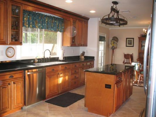 Maple Whiskey Black Glaze Cabinets - Granite Countertop