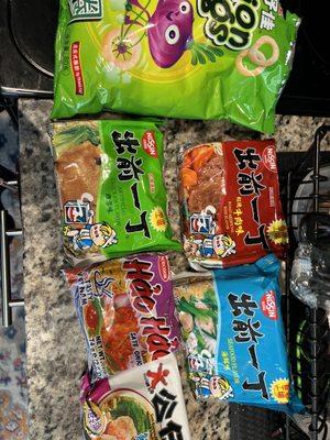 Different types of Ramen and onion rings snacks